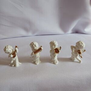 Bone china set of 4 angels gathered playing instruments